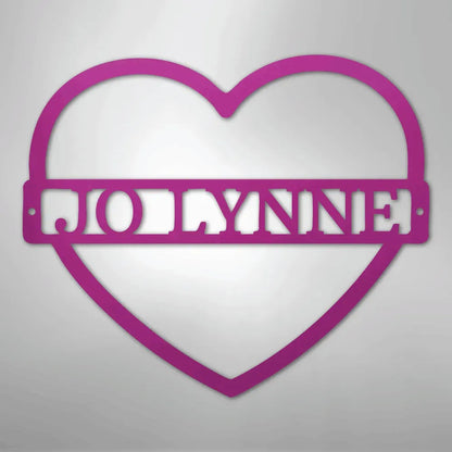 Pink heart-shaped metal wall art with the name "JOLYNNE" cut out in the center.