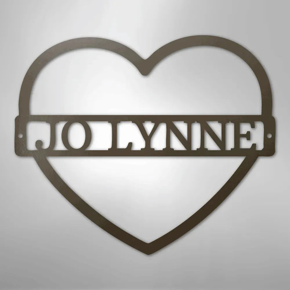 Copper heart-shaped metal wall art with "JOLYNNE" monogram cut out.