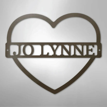 Copper heart-shaped metal wall art with "JOLYNNE" monogram cut out.