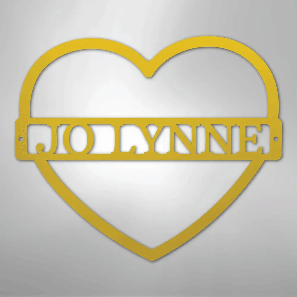 Gold metal heart wall art with "JOLLYNNE" monogram.