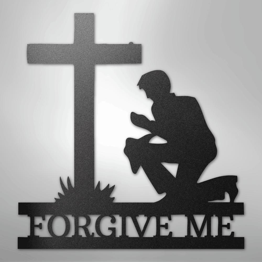 Black metal wall art depicting a kneeling man praying before a cross, with "FORGIVE ME" cut out below.