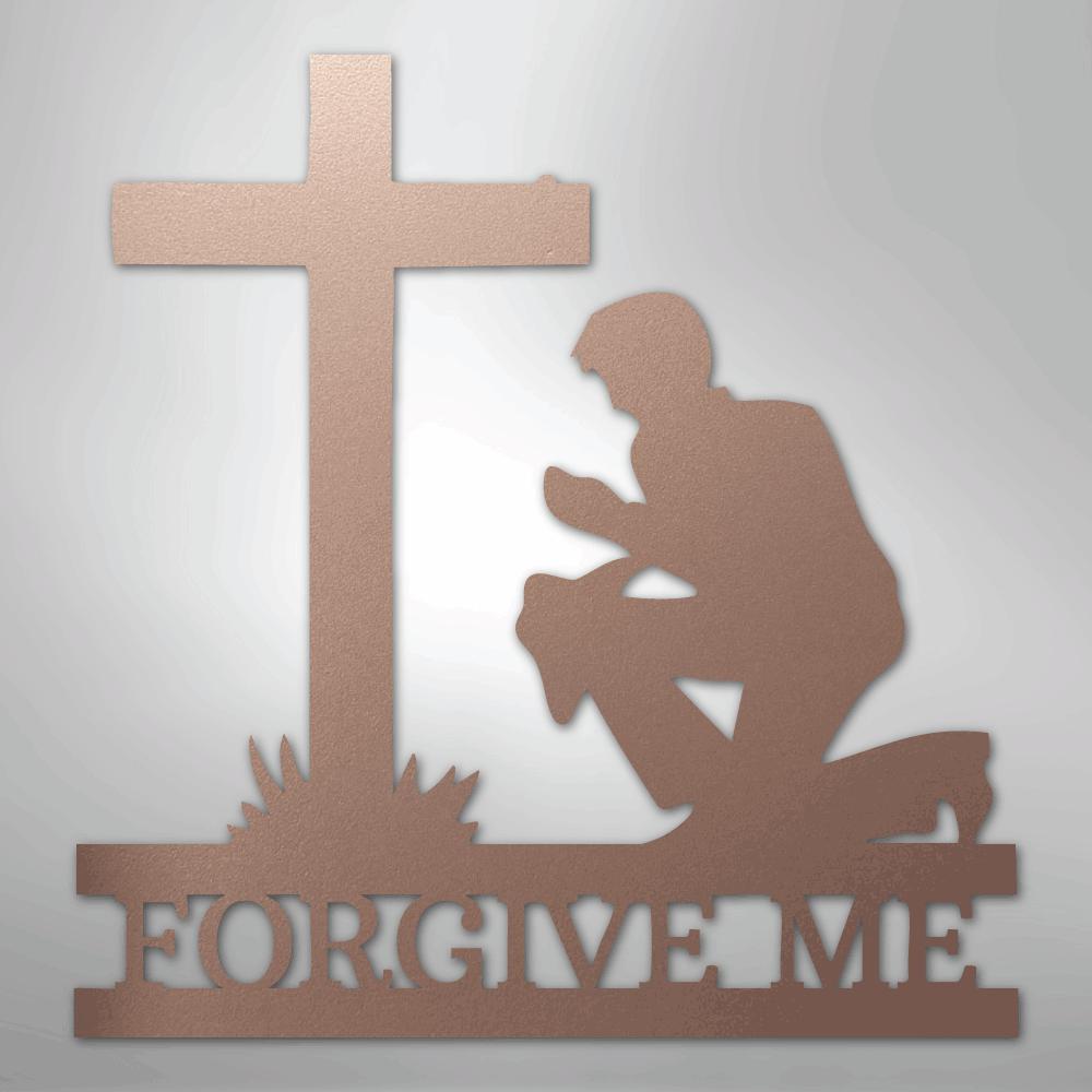 Rose gold metal wall art of a kneeling man praying before a cross, with "FORGIVE ME" cut into the base.