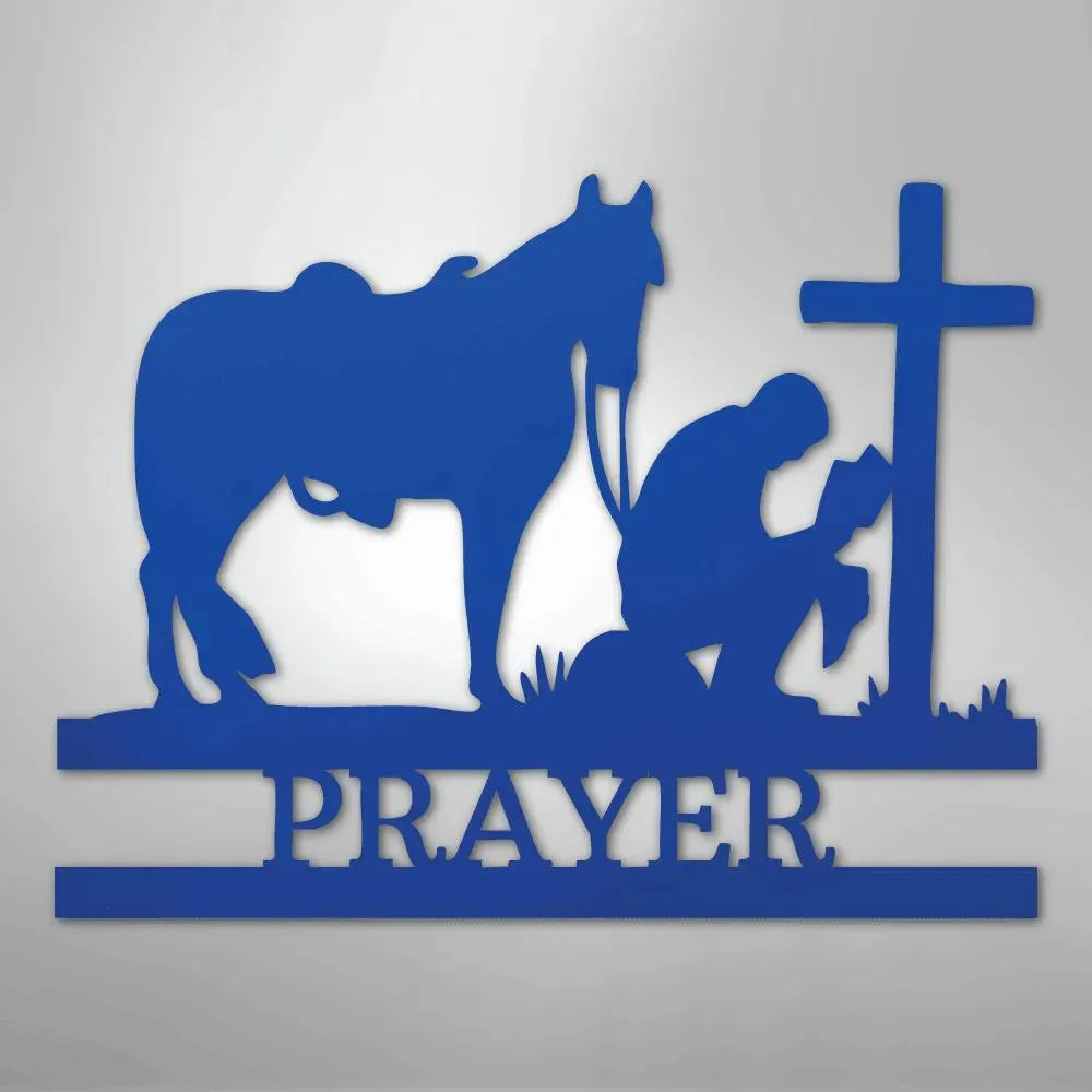 Blue metal wall art: kneeling cowboy, horse, cross, and "PRAYER" text.