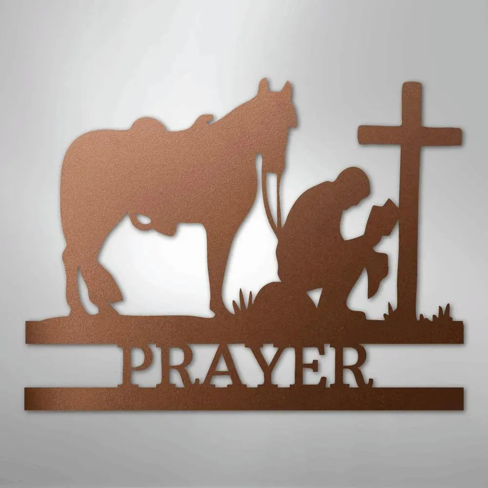 Copper metal wall art: kneeling cowboy, horse, cross, and "PRAYER" text.