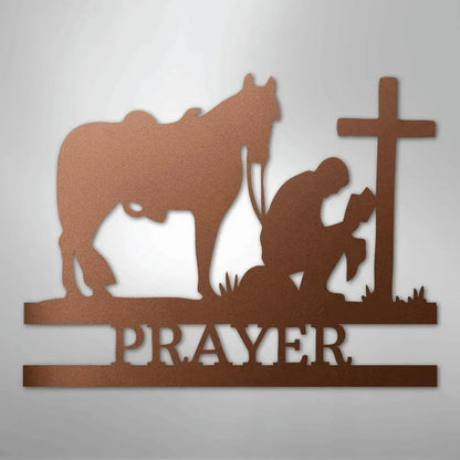 Copper metal wall art: kneeling cowboy, horse, cross, and "PRAYER" text.