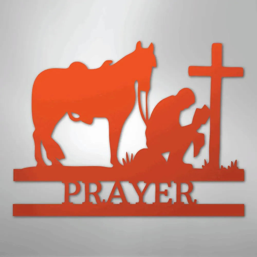 Orange metal wall art: kneeling cowboy praying by a cross with a horse, "PRAYER" below.