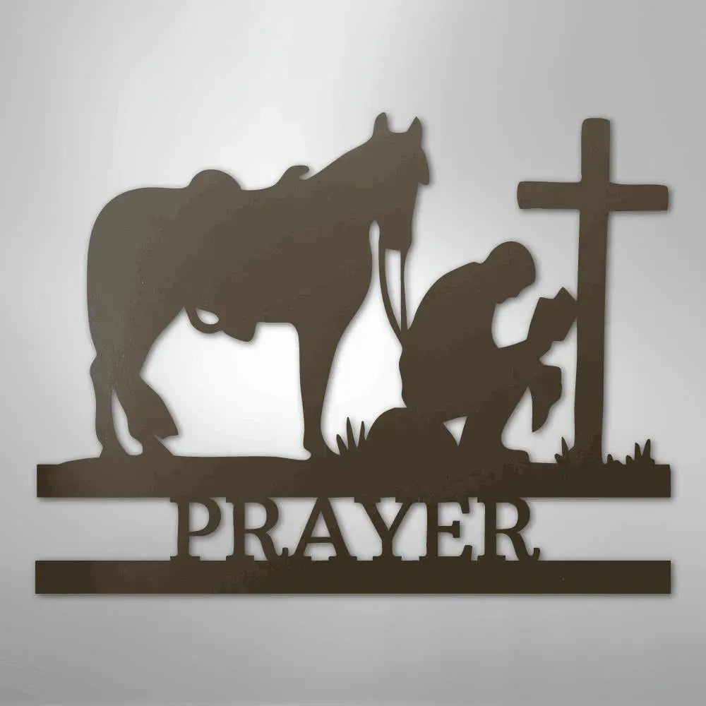 Brown metal wall art: cowboy kneeling by a cross, horse nearby, with "PRAYER" text below.