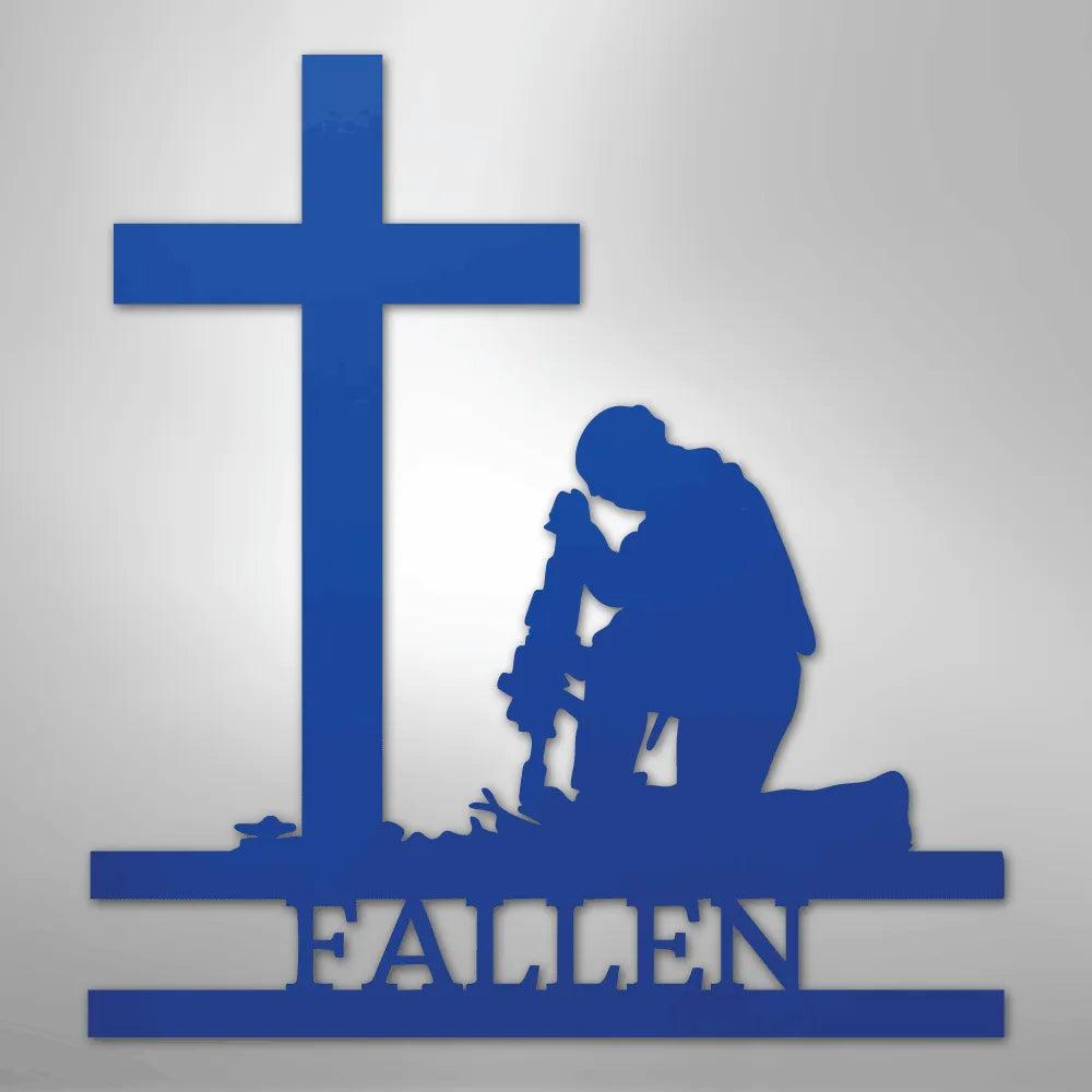 Blue metal wall art depicting a kneeling soldier silhouette before a cross with "FALLEN" below.