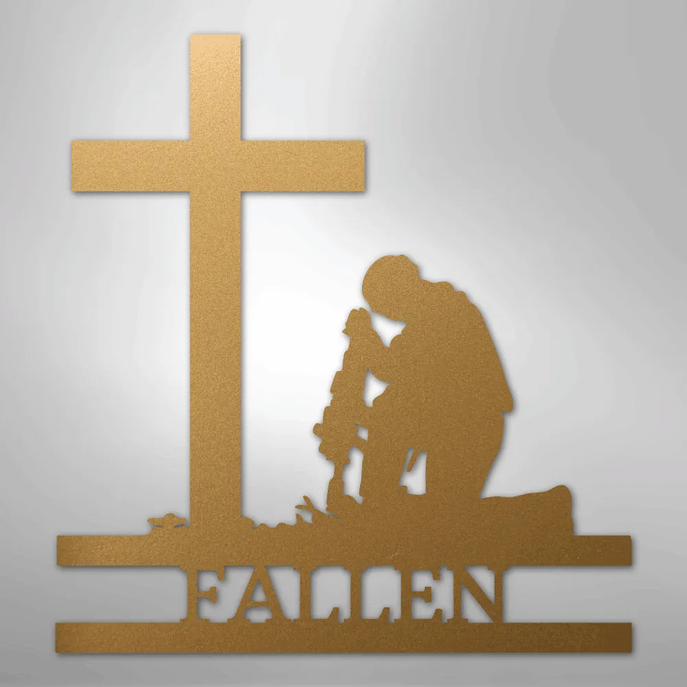 Gold metal wall art of a kneeling soldier with rifle, cross, and "FALLEN" text.