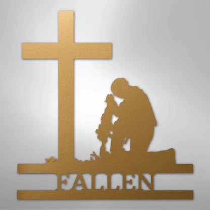 Gold metal wall art of a kneeling soldier with rifle, cross, and "FALLEN" text.