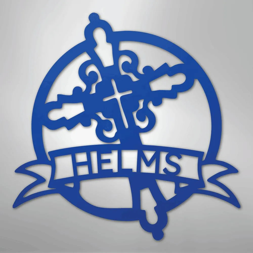 Blue metal Catholic monogram wall art with ornate cross and "HELMS" name banner.