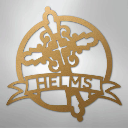 Gold Catholic monogram metal wall art with a cross, crown, and "HELMS" banner.