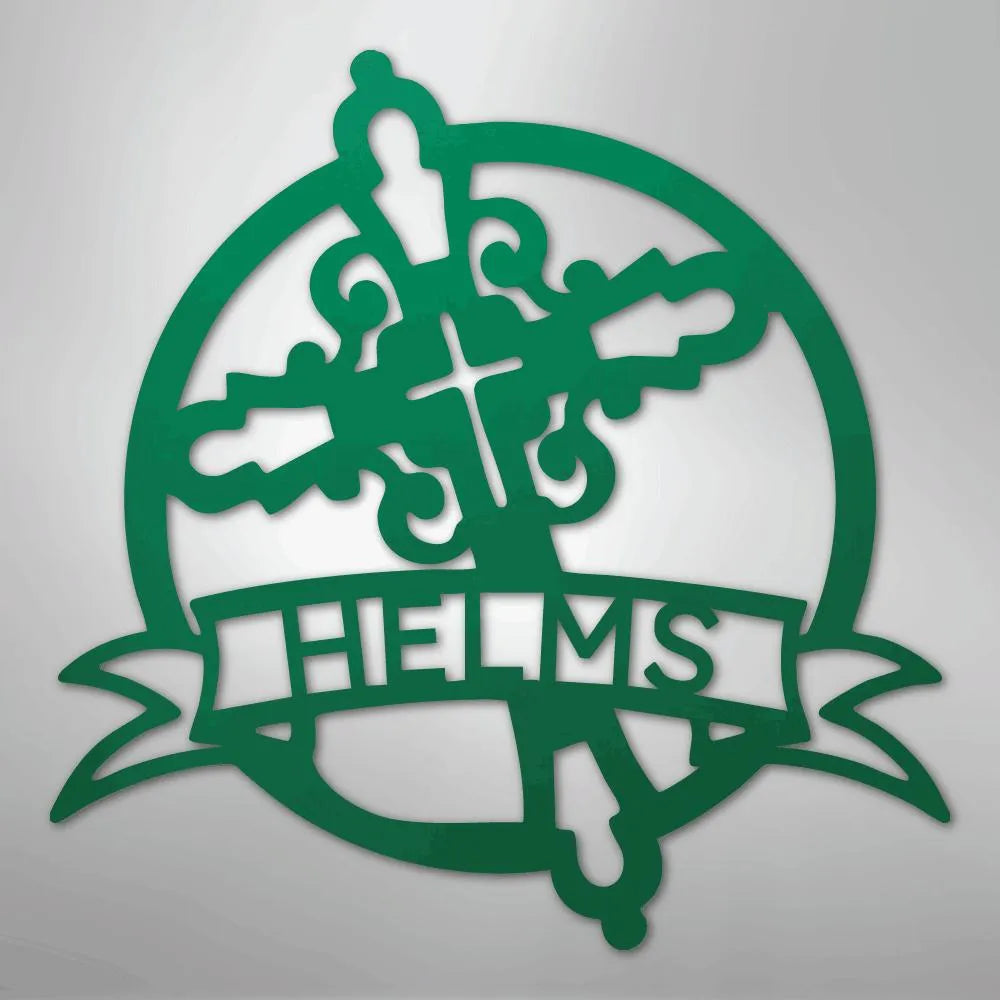 Green metal Catholic monogram wall art with a cross, ornate circle, and "HELMS" on a banner.