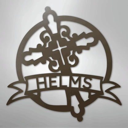 Brown metal Catholic monogram wall art with a cross, ornate flourishes, and "HELMS" on a banner.