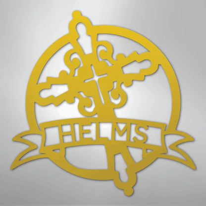 Gold Catholic monogram metal wall art featuring a cross, ornate design, and "HELMS" banner.