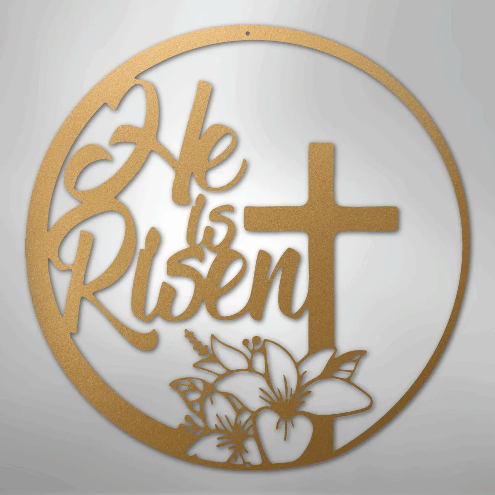 Gold "He is Risen" metal wall art with a cross and lilies in a circular design.