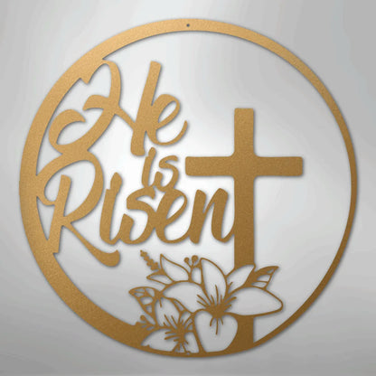 Gold "He is Risen" metal wall art with a cross and lilies in a circular design.