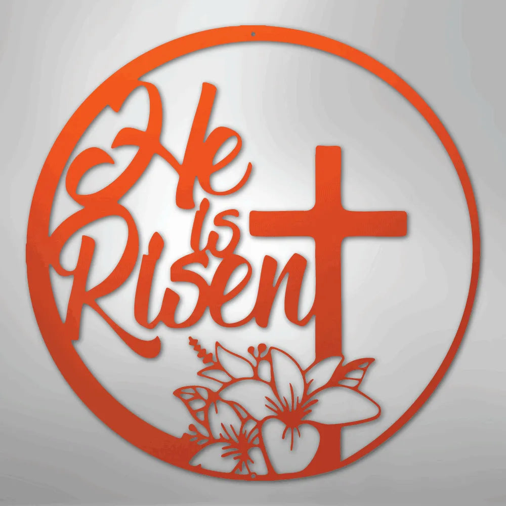 Orange "He is Risen" metal wall art with a cross and lilies in a circular design.