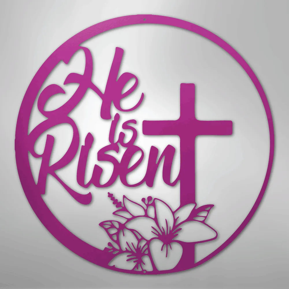Pink "He is Risen" metal wall art with a cross and lilies in a circular design.