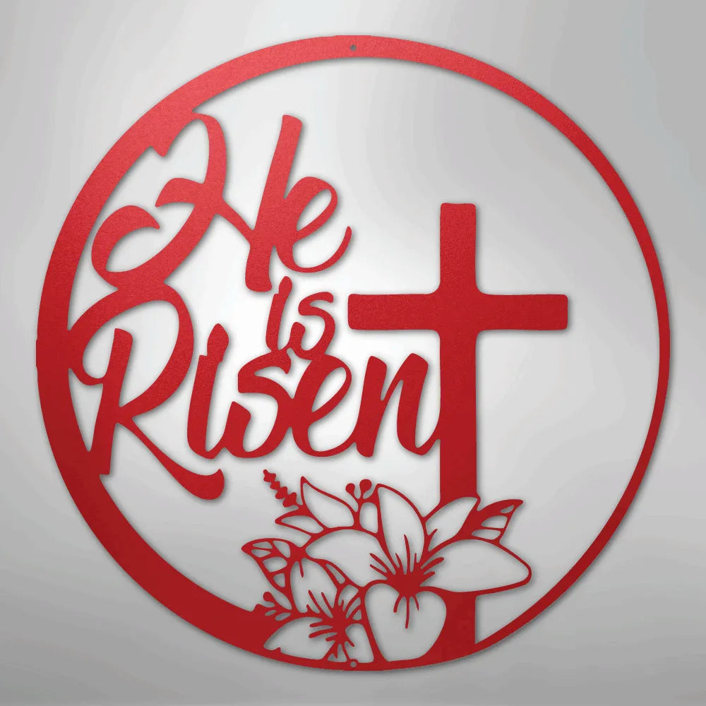 Red "He is Risen" metal wall art with a cross and lilies inside a circular frame.