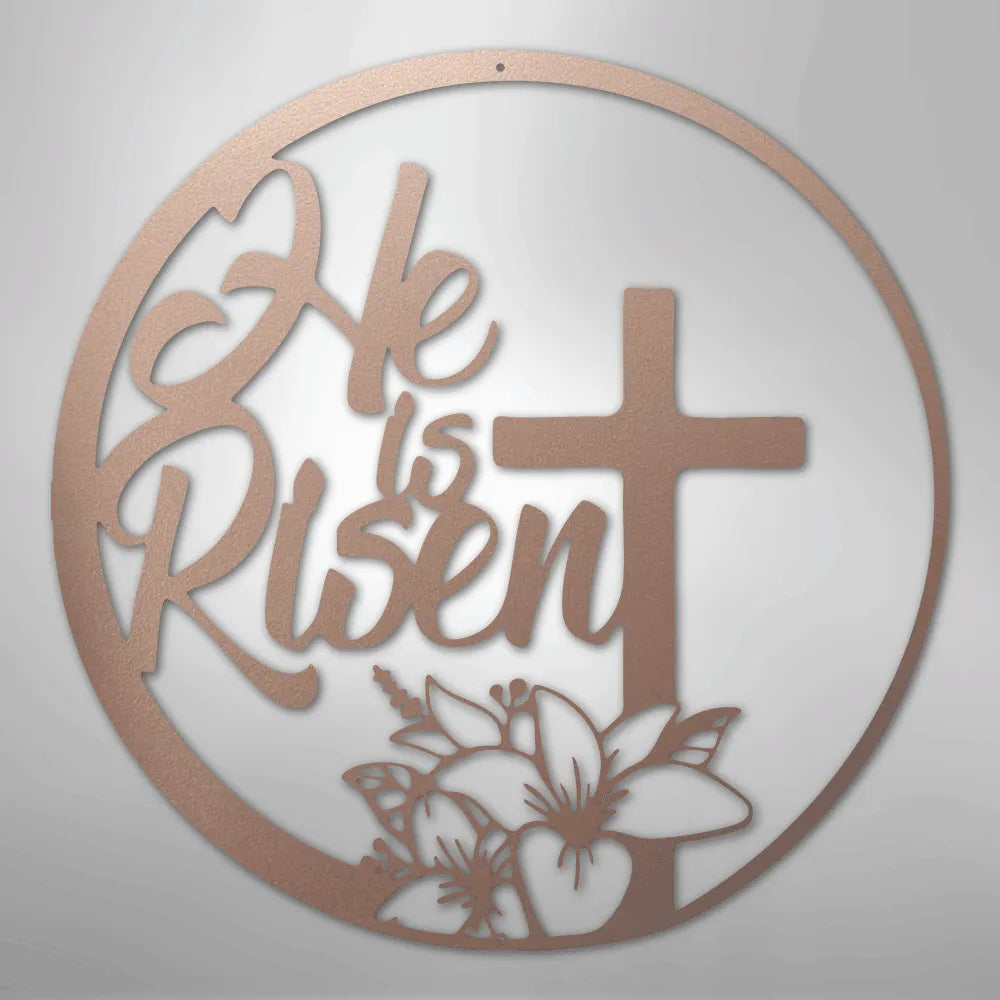 Copper "He is Risen" metal wall art with a cross and lily design in a circular frame.