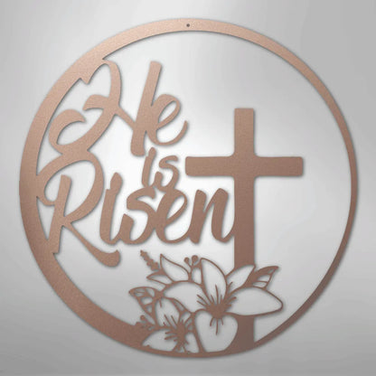 Copper "He is Risen" metal wall art with a cross and lily design in a circular frame.
