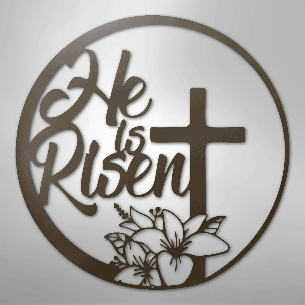 Brown metal "He is Risen" wall art with a cross and lilies inside a circular frame.