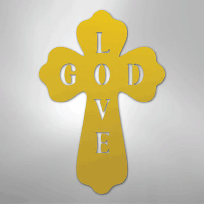 Gold metal cross wall art with "GOD" vertically and "LOVE" horizontally cut out.