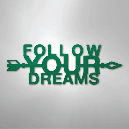 Green metal wall art spelling "Follow Your Dreams" with an arrow design.