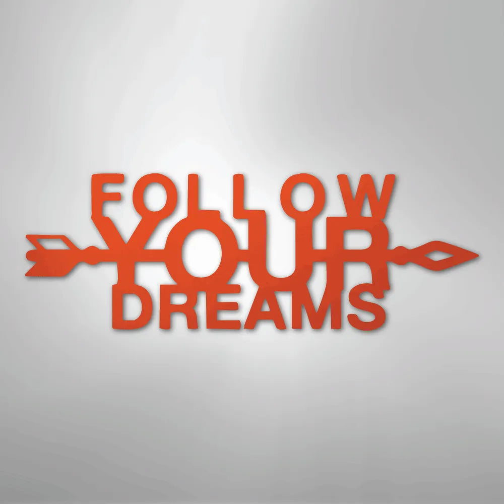 Orange metal "Follow Your Dreams" wall art with an arrow design, inspiring decor.