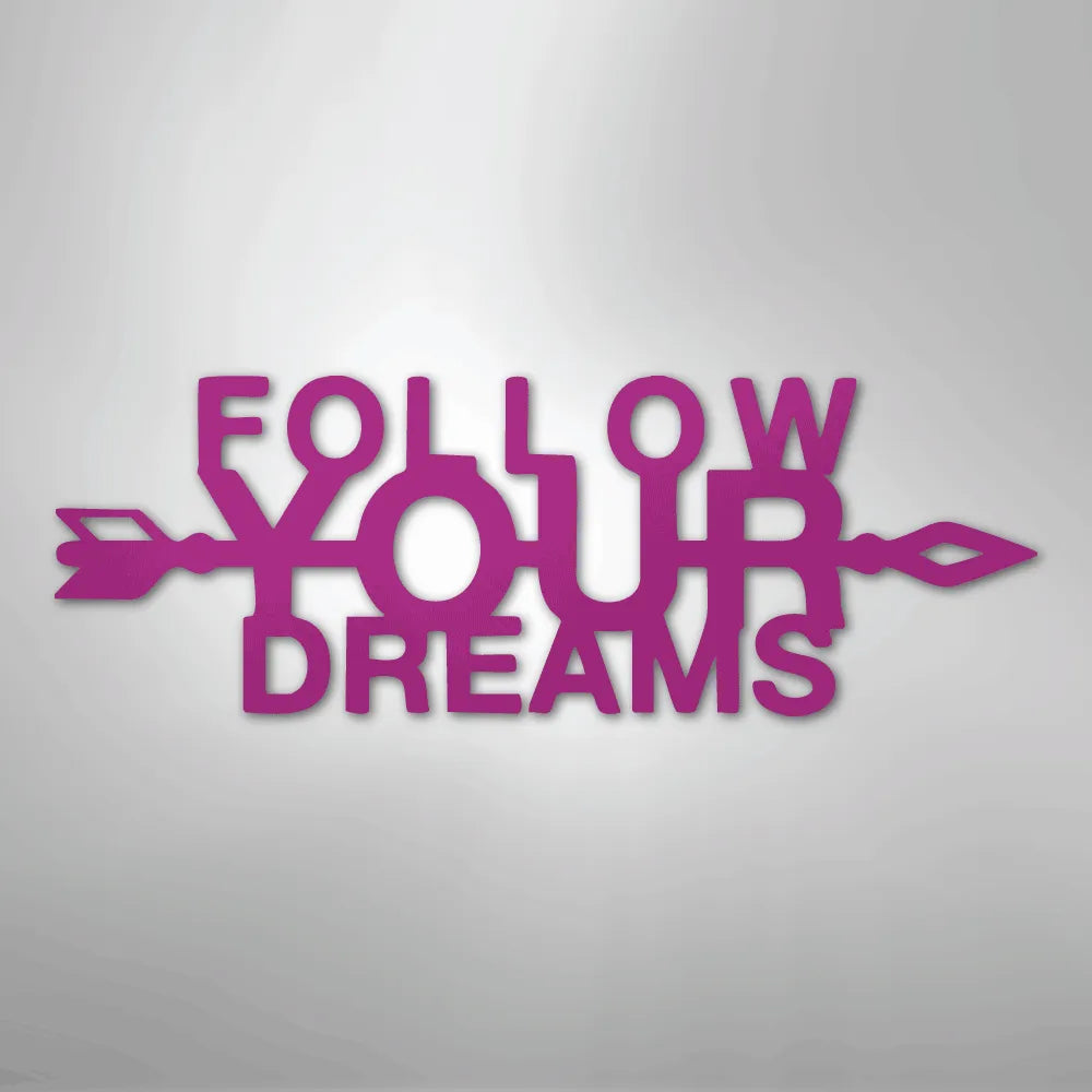 Magenta "Follow Your Dreams" metal wall art with an arrow design.