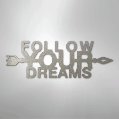 Silver "Follow Your Dreams" metal wall art with an arrow design, crafted from American steel.