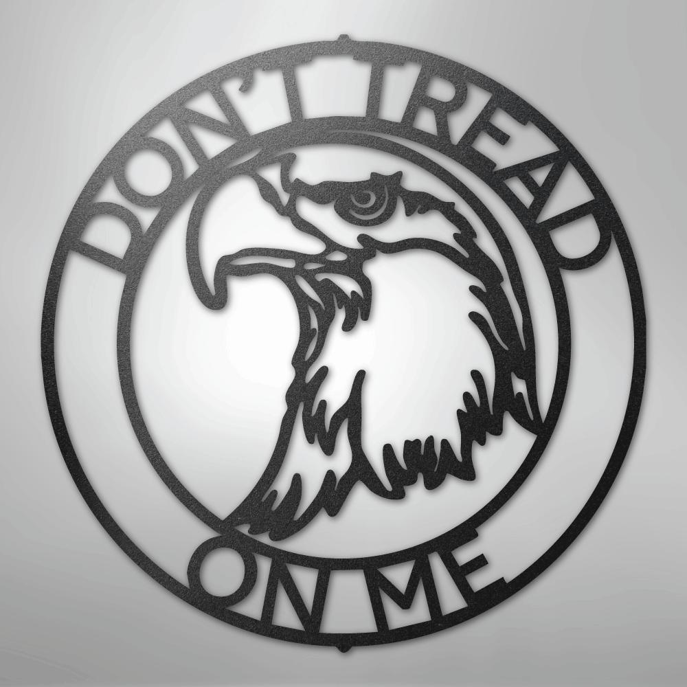 Black metal "Don't Tread On Me" circular wall art with an eagle head profile.