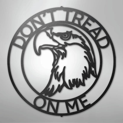 Black metal "Don't Tread On Me" circular wall art with an eagle head profile.