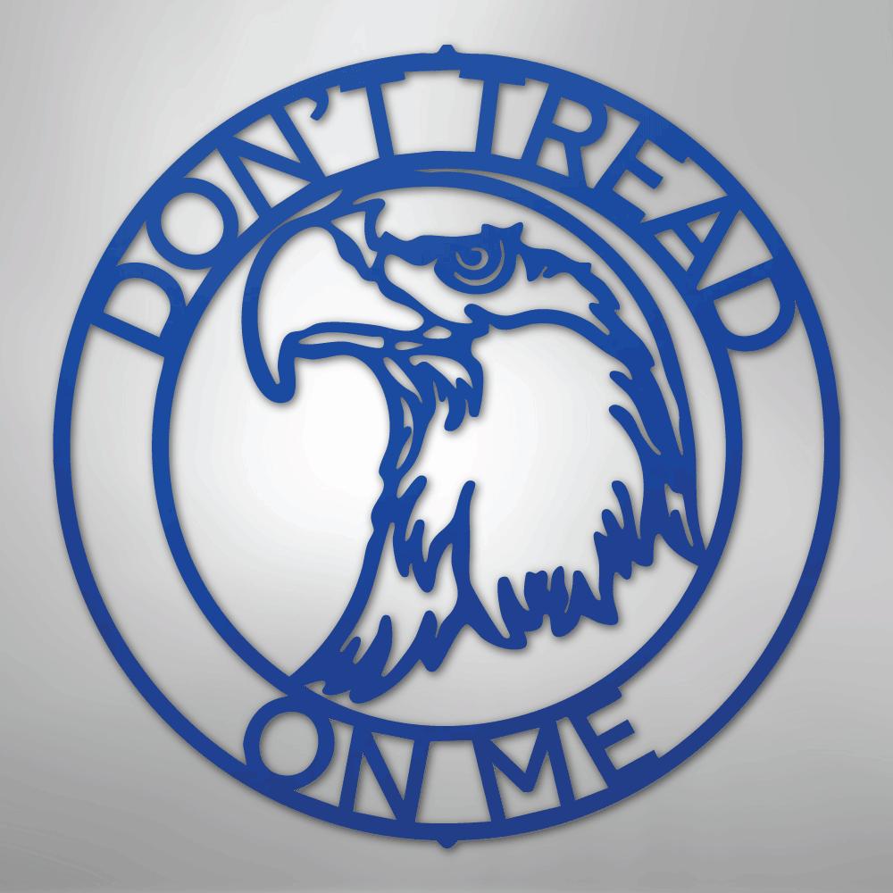 Blue metal wall art featuring an eagle head inside a ring with "DON'T TREAD ON ME" text.