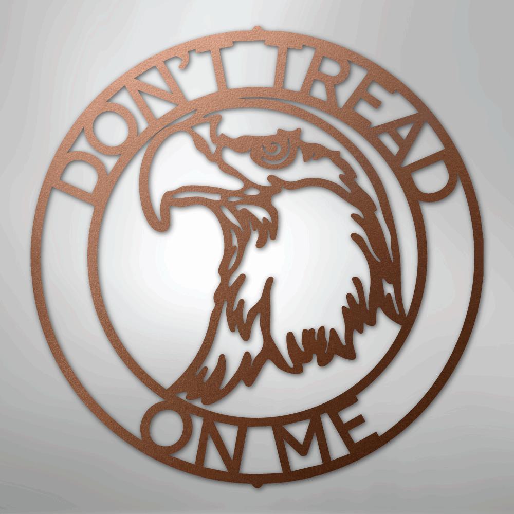 Copper metal wall art: "Don't Tread on Me" text encircles an eagle head in a round design.