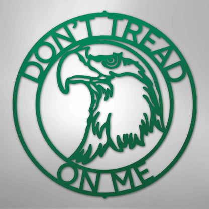 Green metal wall art: "Don't Tread On Me" text encircles an eagle head design.