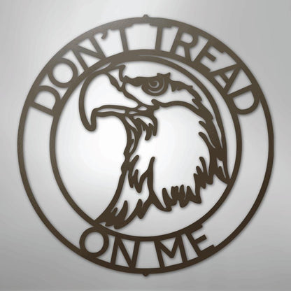 Brown metal wall art featuring an eagle head in a ring with "DON'T TREAD ON ME" text.