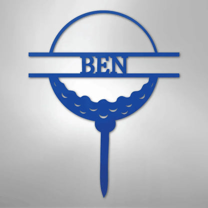 Blue metal golf ball monogram wall art with "BEN" cut out, featuring a tee base.