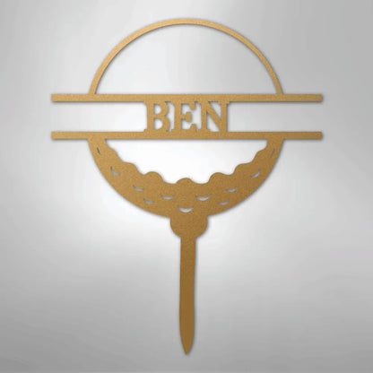 Gold metal wall art featuring a golf ball monogram with the name "BEN" in the center.