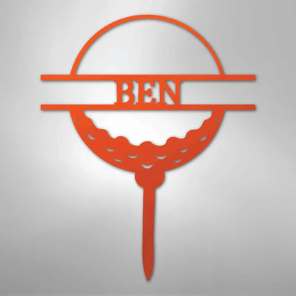 Orange metal golf ball monogram wall art with "BEN" cut out, on a tee design.
