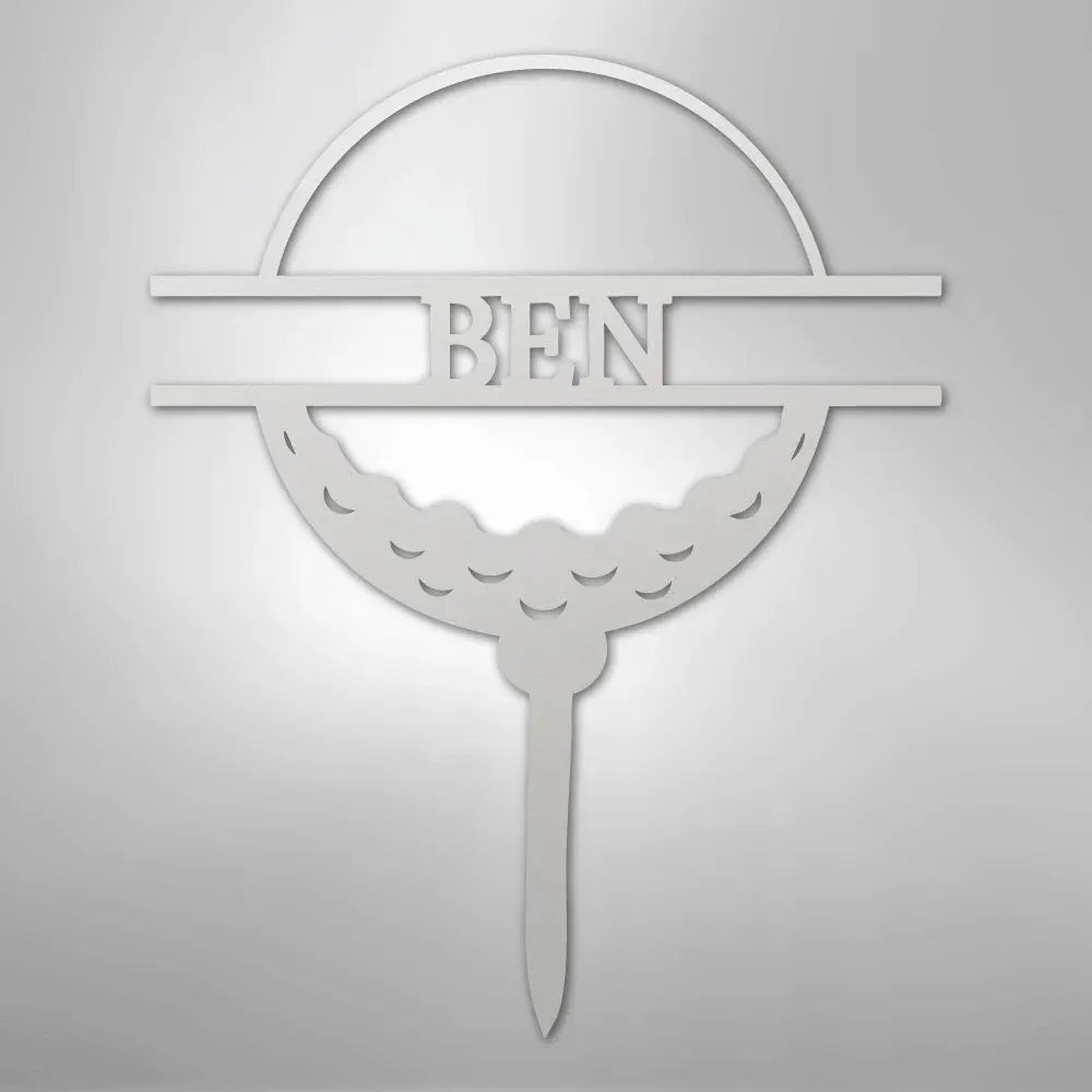White metal golf ball monogram wall art with "BEN" cut out, featuring a tee base.