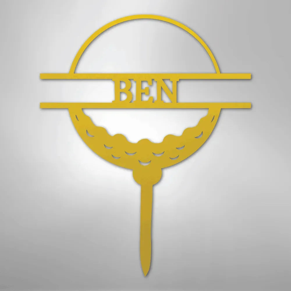 Gold metal golf ball monogram wall art with "BEN" in the center, on a tee.