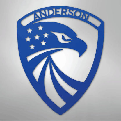 Blue metal shield with an eagle head, stars, and "ANDERSON" custom text.