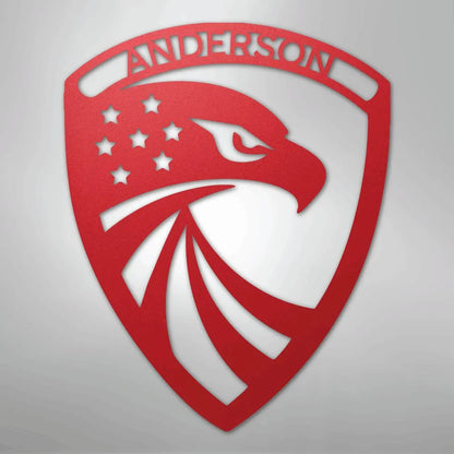 Red metal shield with an eagle head, stars, and "ANDERSON" text.