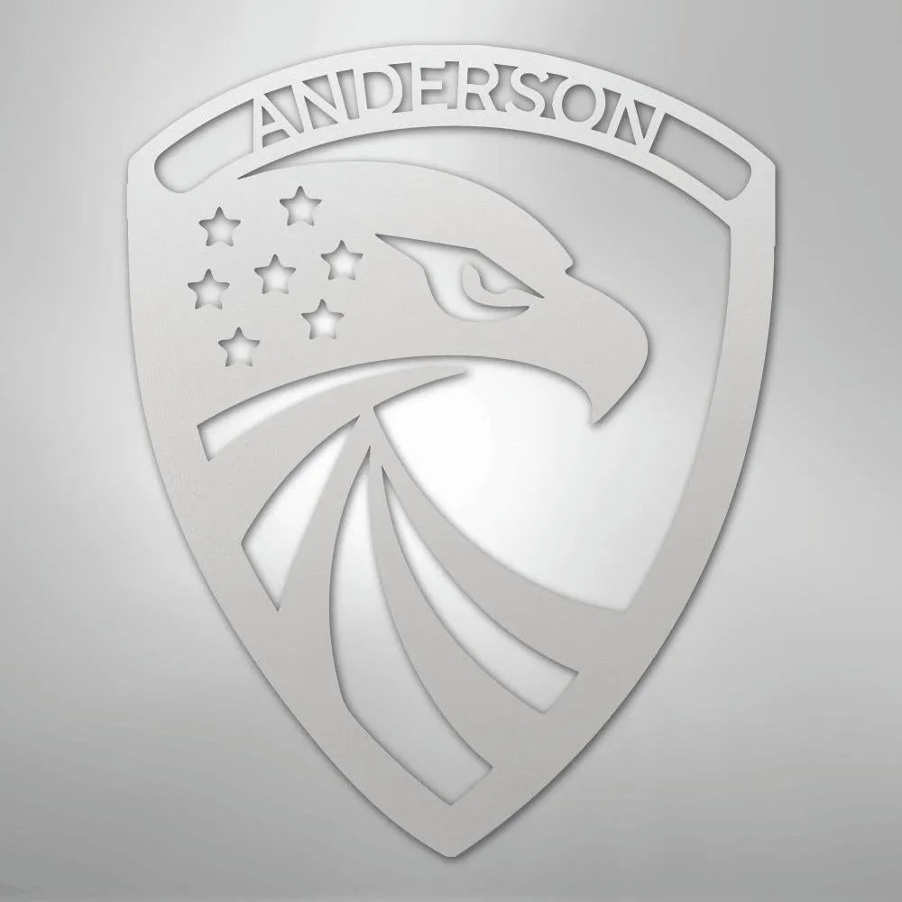 Silver metal shield art with an eagle head, stars, and "ANDERSON" at the top.