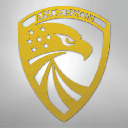 Gold metal wall art: Modern Eagle Monogram shield with "ANDERSON" and stars.