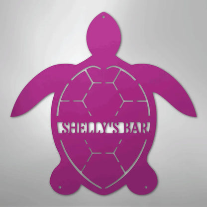 Pink metal turtle wall art with "SHELLY'S BAR" cut out, featuring a honeycomb shell design.