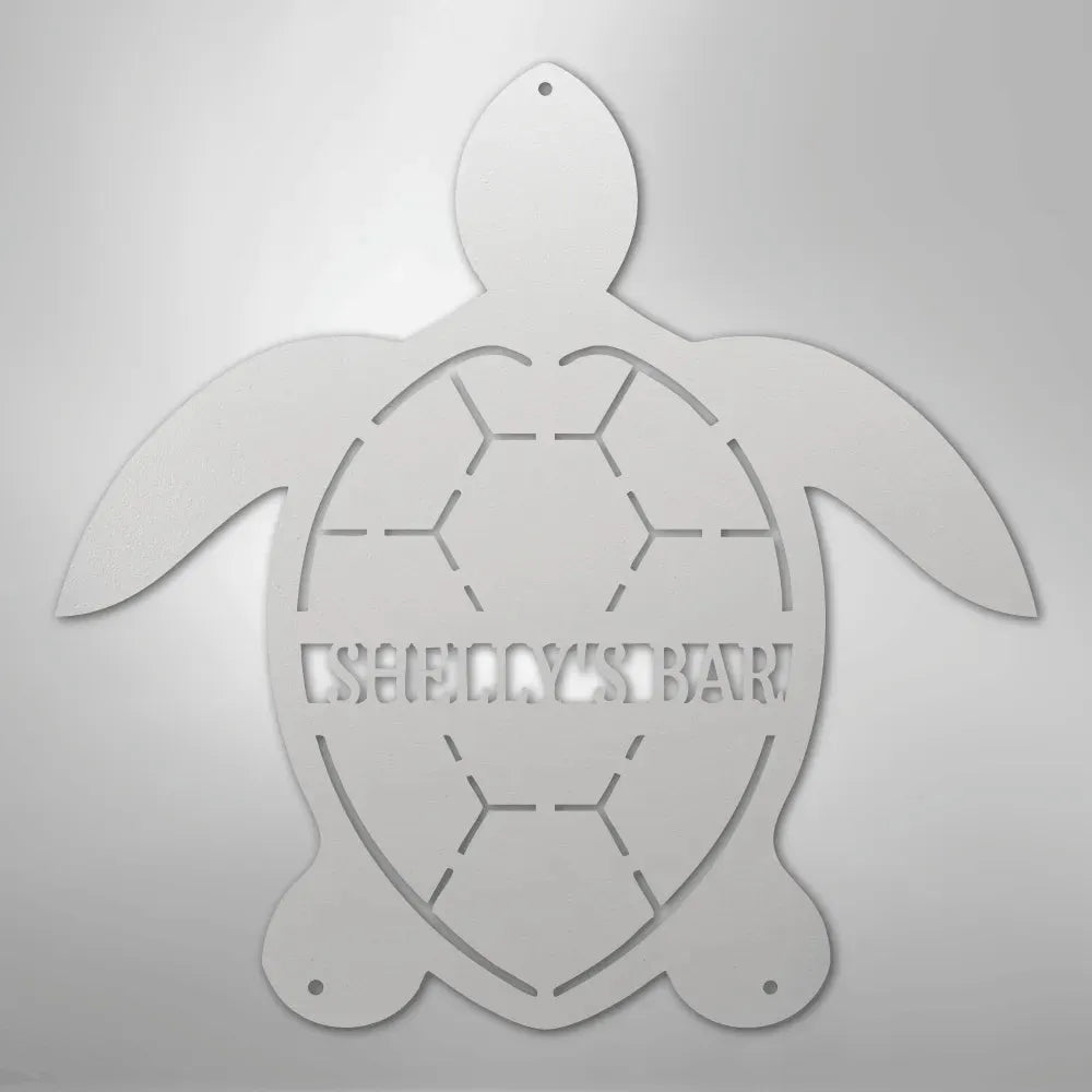 White metal turtle wall art with "SHELLY'S BAR" cut out of the shell.