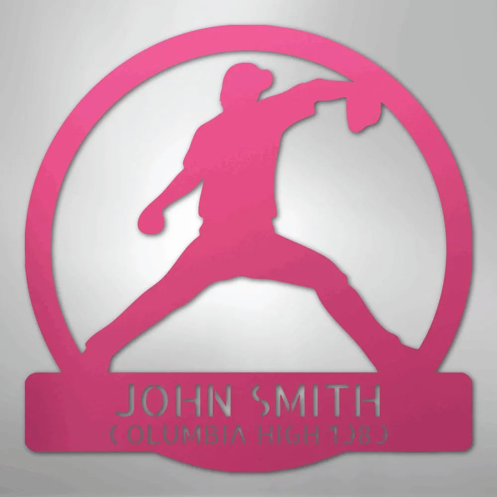 Pink metal wall art featuring a baseball pitcher silhouette within a circle, personalized with "JOHN SMITH" and "COLUMBIA HIGH 1283".